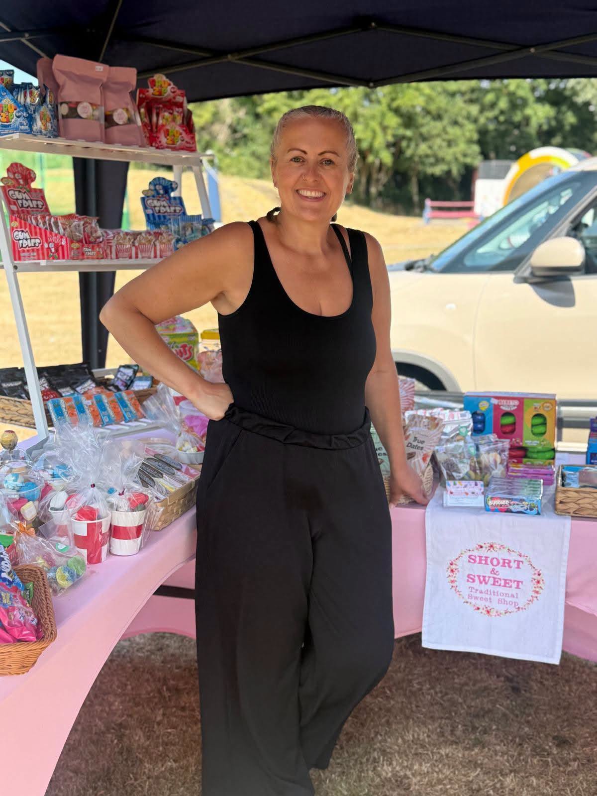 Sue Quilter at the Short & Sweet market stall with sweets on display