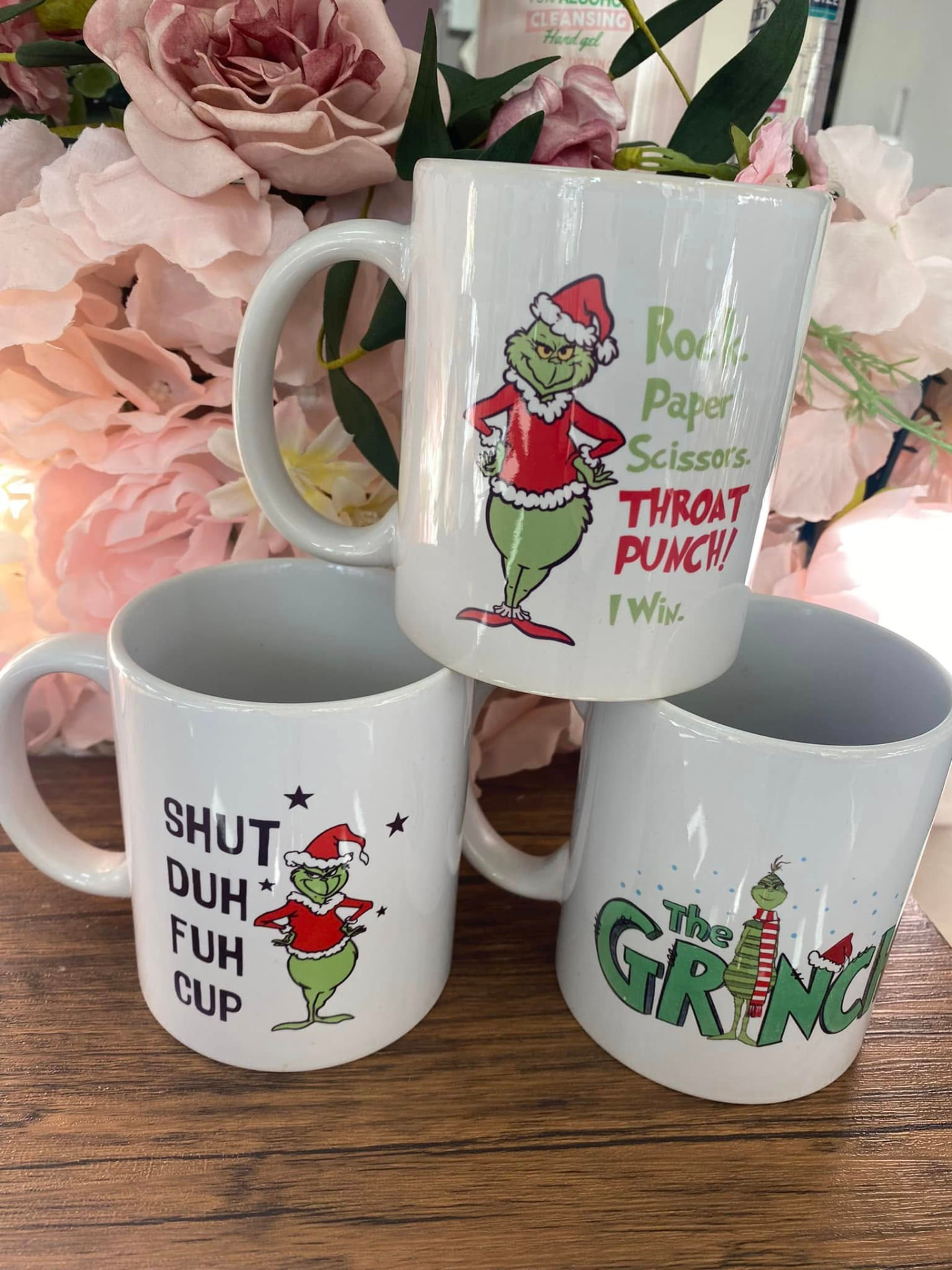 Novelty Grinch Christmas mugs on display